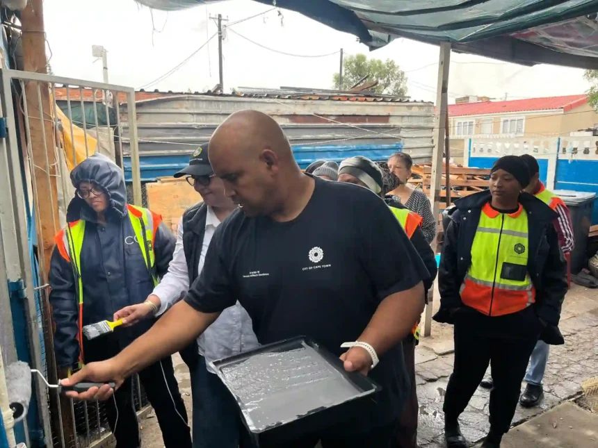 Deputy Mayor Eddie Andrews with MURP and Atterbury team observing house painting project in Uitsig, Cape Town
