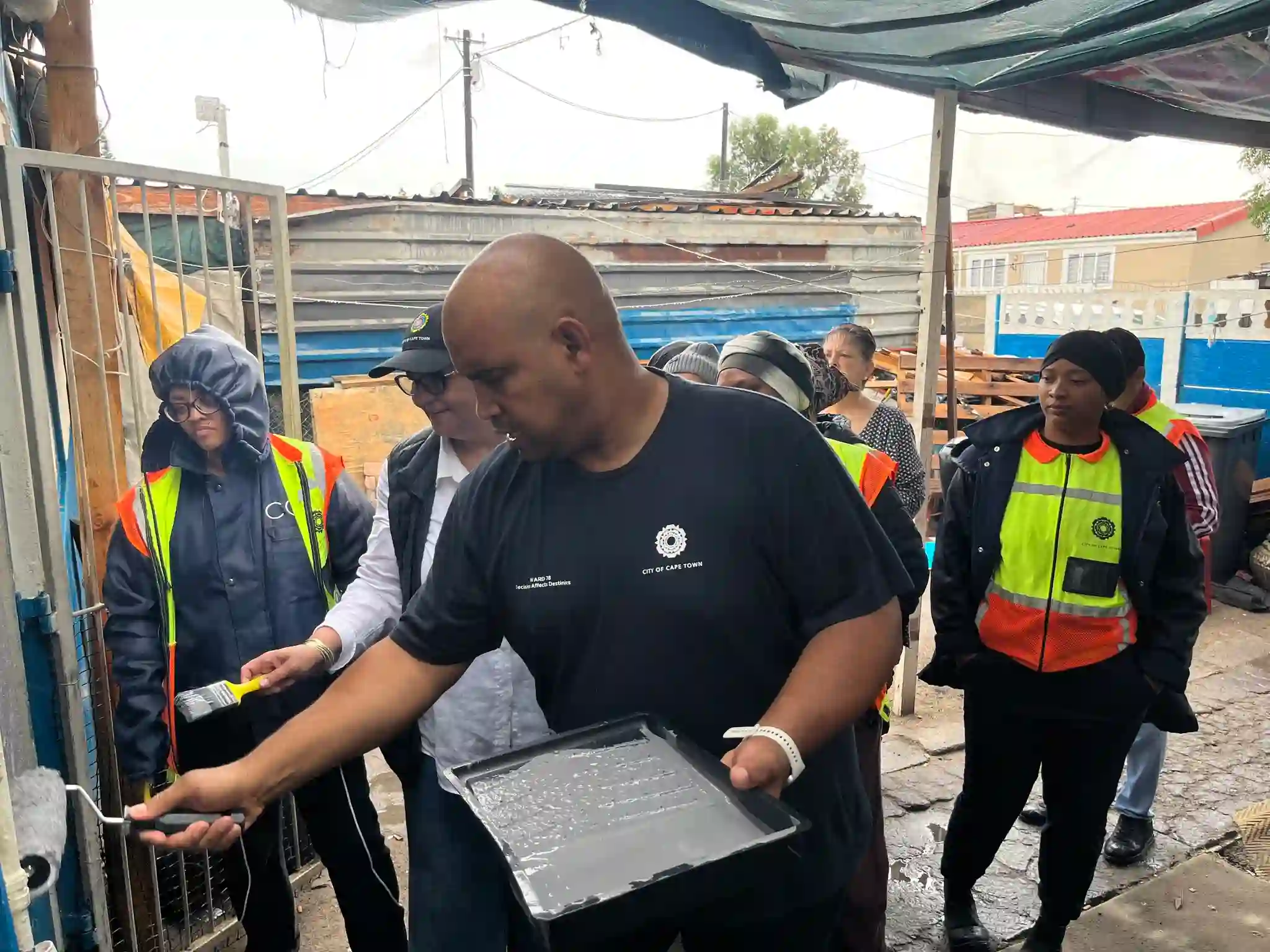 Deputy Mayor Eddie Andrews with MURP and Atterbury team observing house painting project in Uitsig, Cape Town