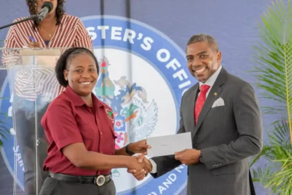 Prime Minister Dr. Terrance Drew distributing the new Digital Insurance Card to a Public Servant of St. Kitts and Nevis