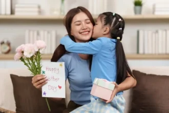 A kid wishing Happy Mother's Day to her Mother