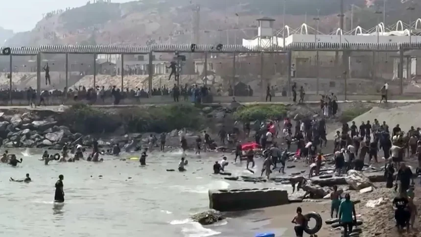 thousands of migrants entered into Spain from Morocco