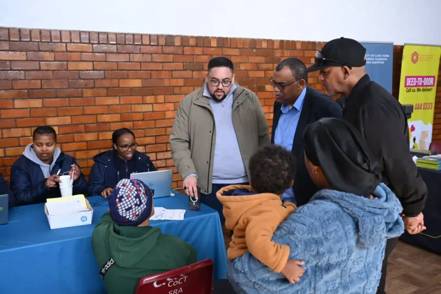 Human Settlements team while handing over title deeds to 65 families in Heideveld